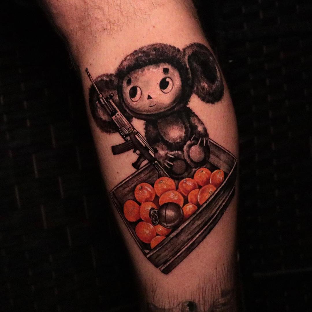 Tattoo cheburashka on the leg in style black & gray