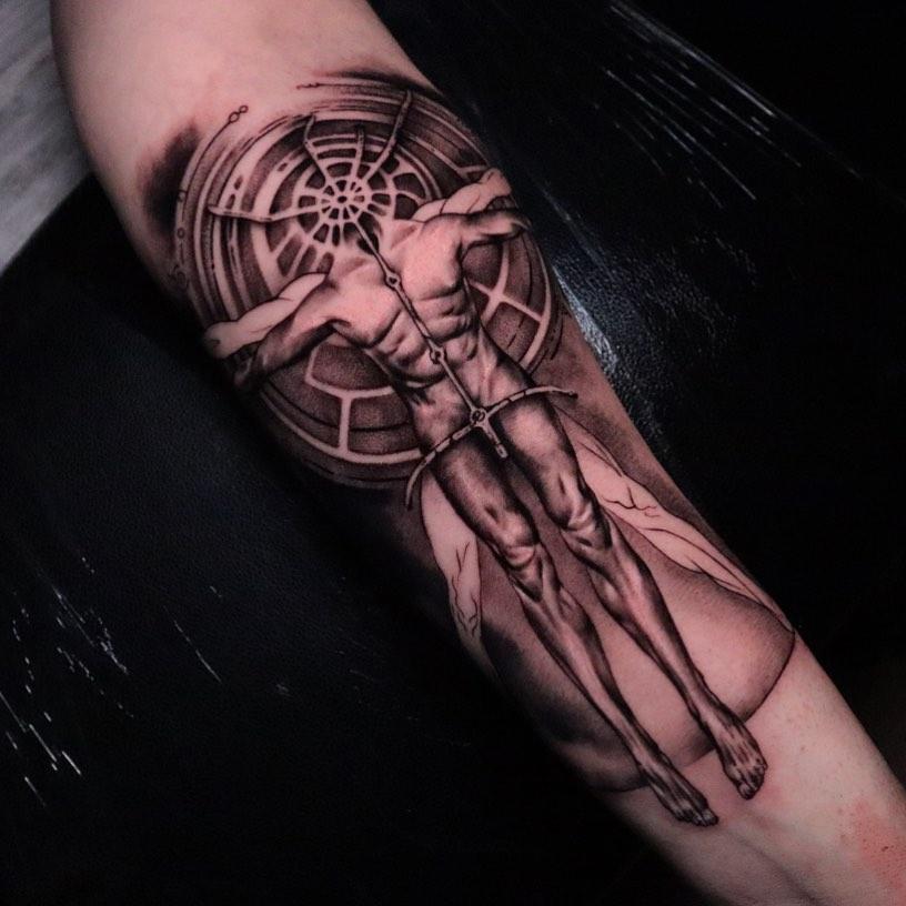 Tattoo vitruvian man on the forearm in style graphic